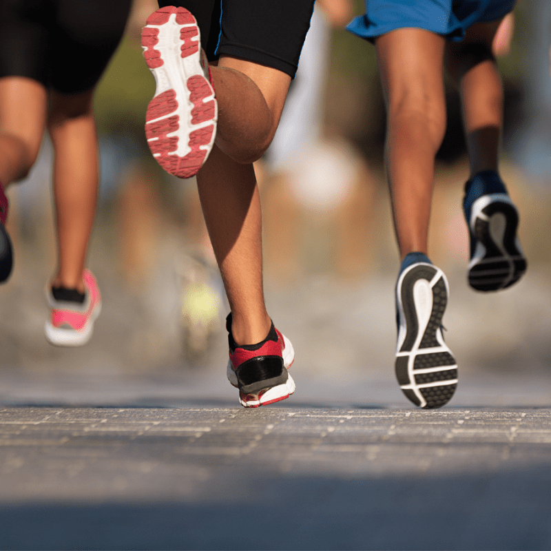 Feet running in a sunny day