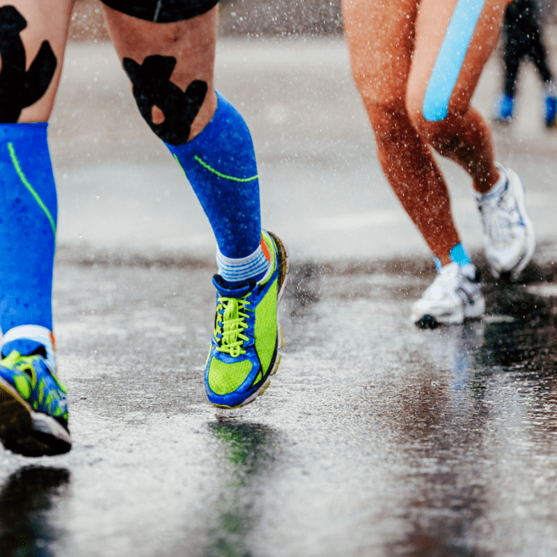 Feet running in a rainy day 