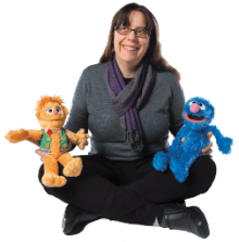 Dina Borzekoski, faculty member of School of Public Health from the University of Maryland, and muppet friends