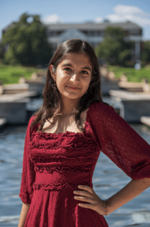 girl with red dress and hand on hip