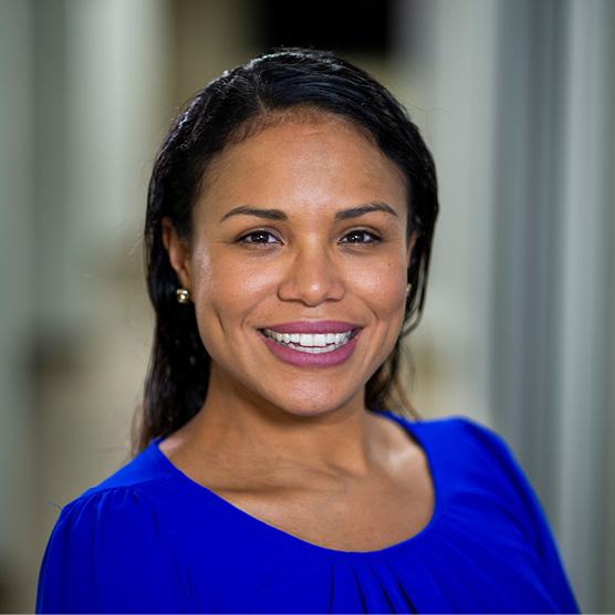 Rianna Murray, alumna of the School of Public Health at the University of Maryland with red background