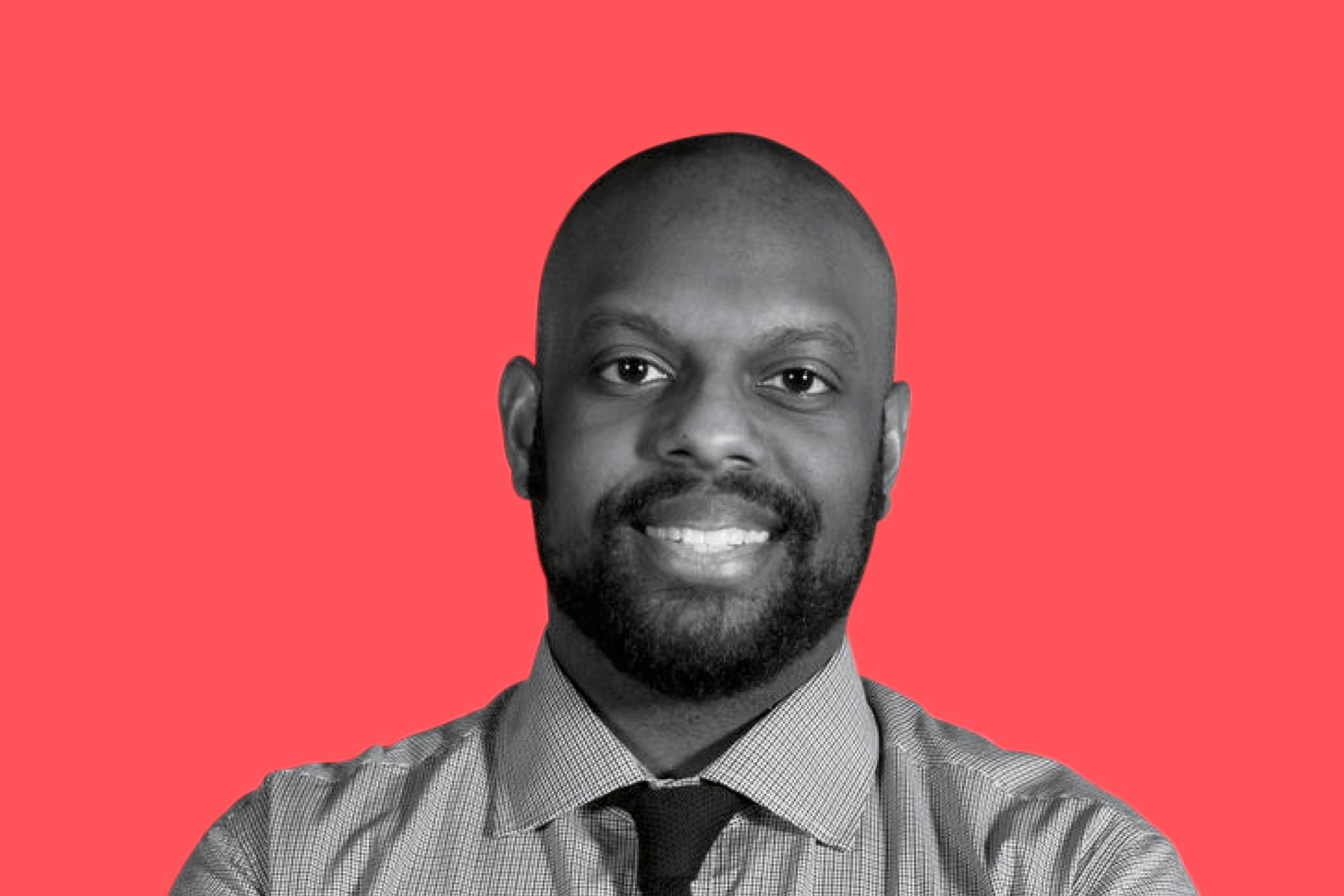 Andre Blackman, dean's council member of School of Public Health with red background