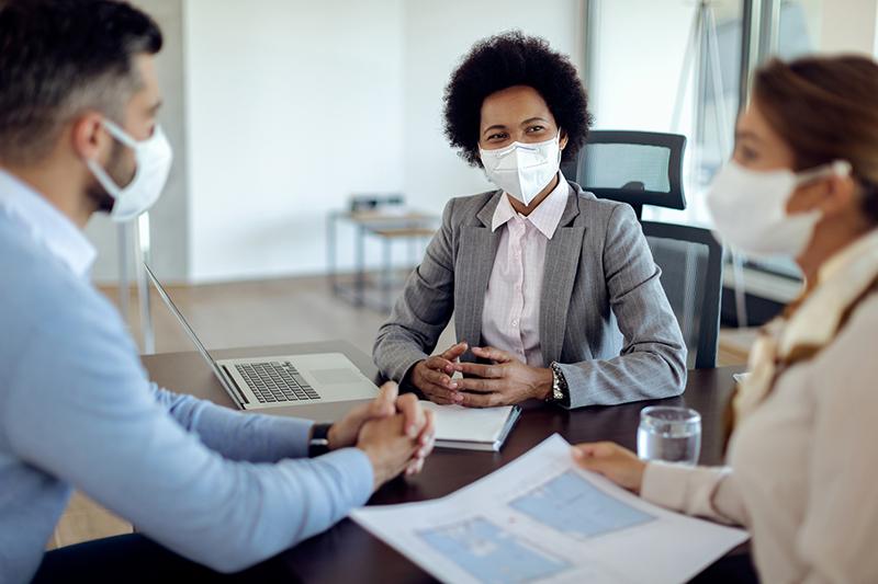 Group of professionals wearing protective masks