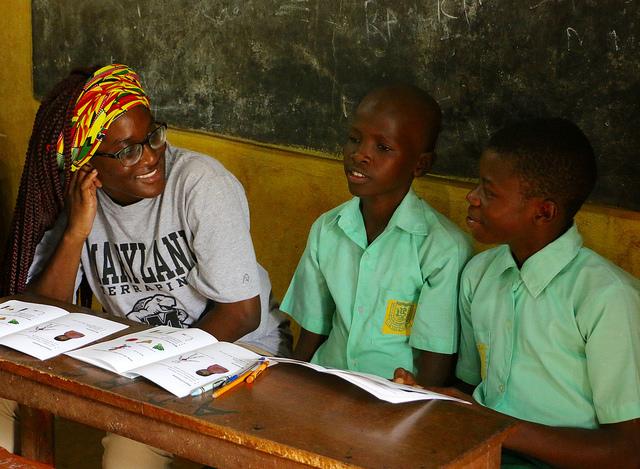 Public Health Science major Ugochi Chinemere interacts with children at the Abigail D. Butcher School in Calaba Town, Sierra Leone