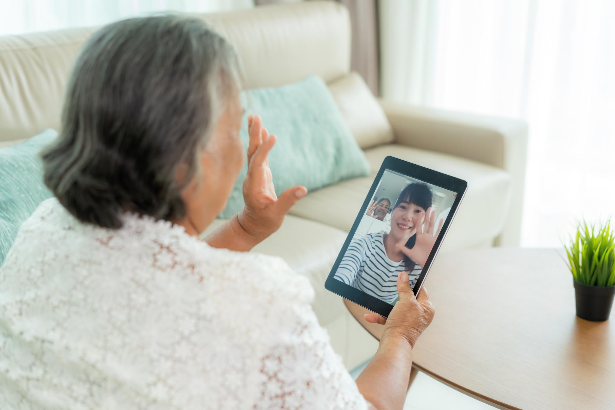 Elderly woman video chatting