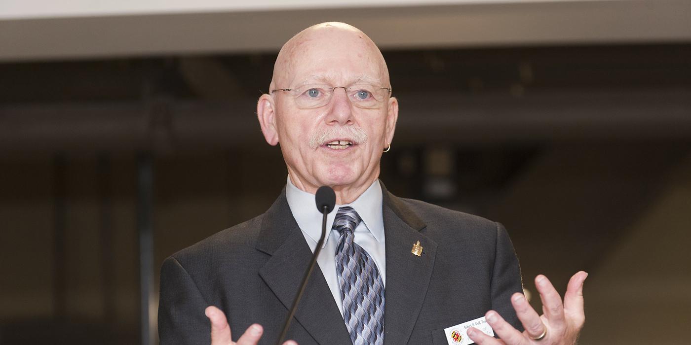 Dr. Robert S. Gold, faculty member of School of Public Health at the University of Maryland, speaking through a microphone. 