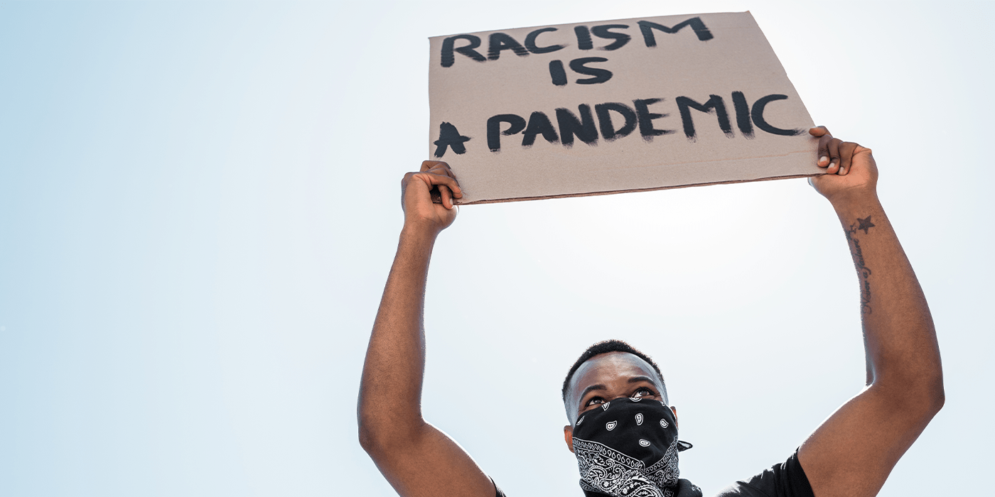 Racism is a pandemic protest sign