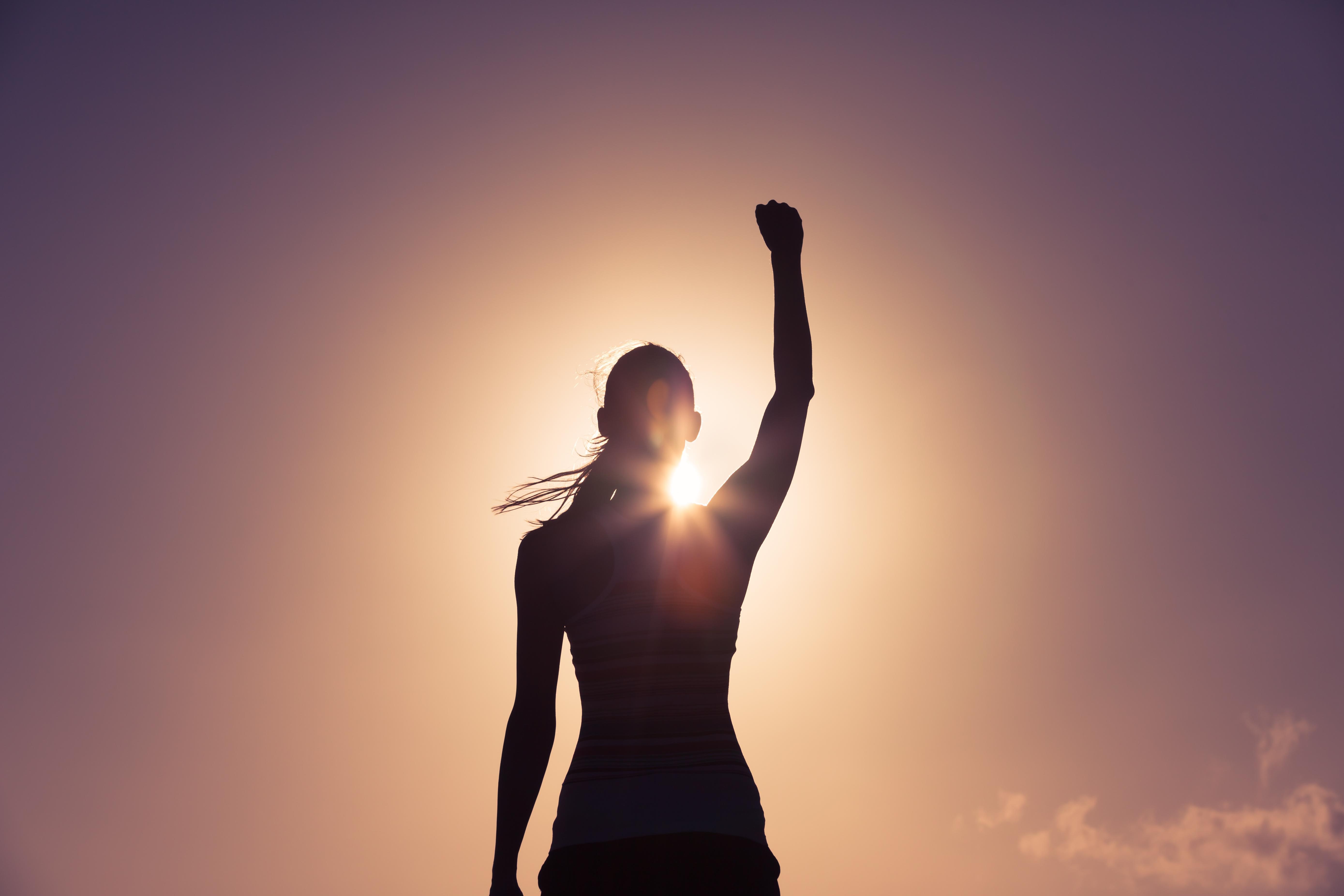 Woman putting fist in the air