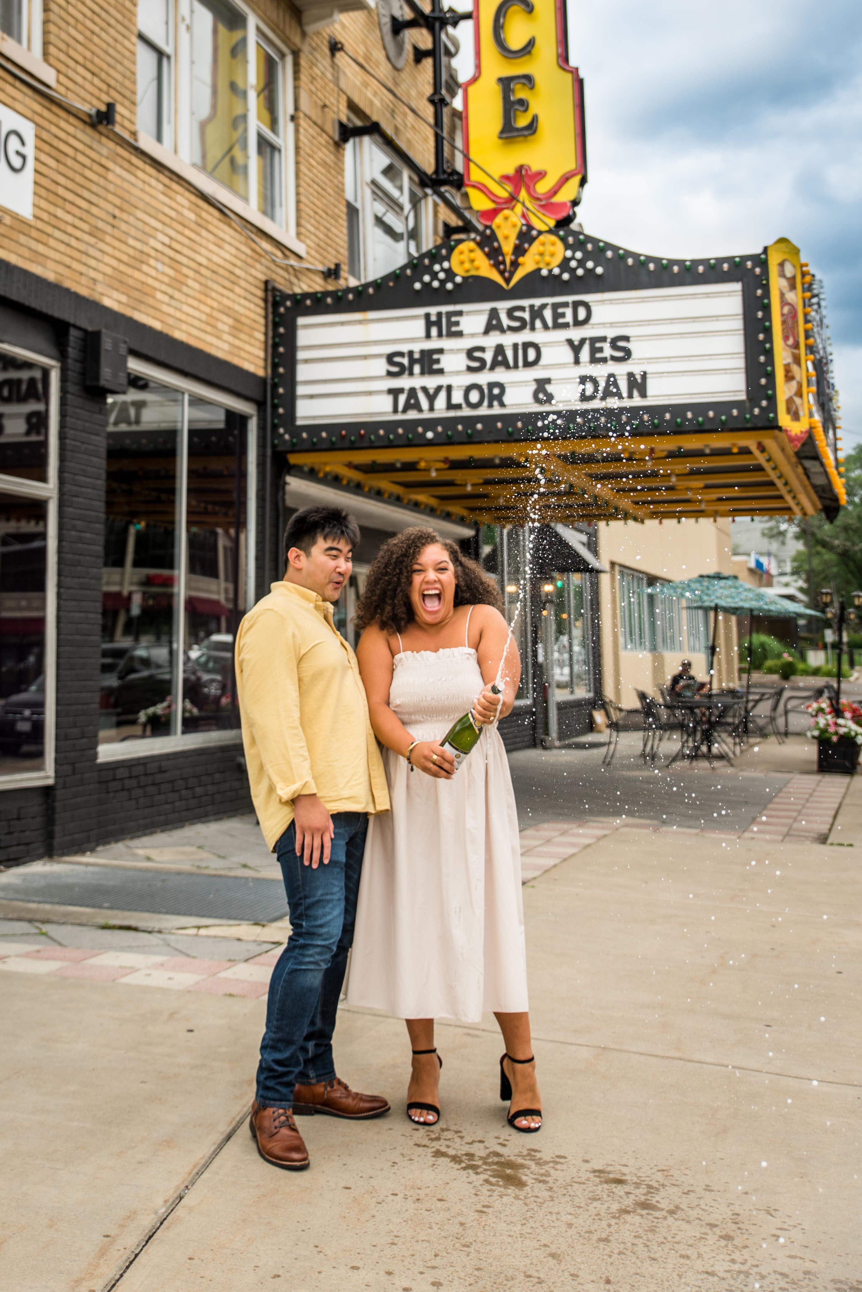 Taylor Sanders and Dan celebrating their engagement with champagne