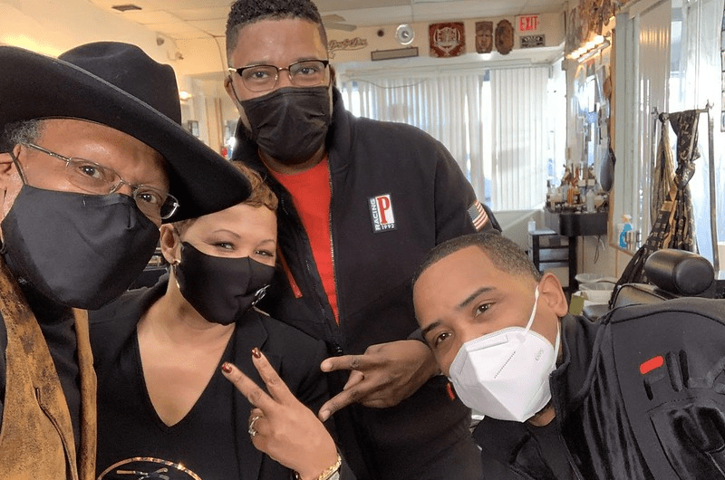 H.A.I.R. Founders posing in the Barbershop in masks