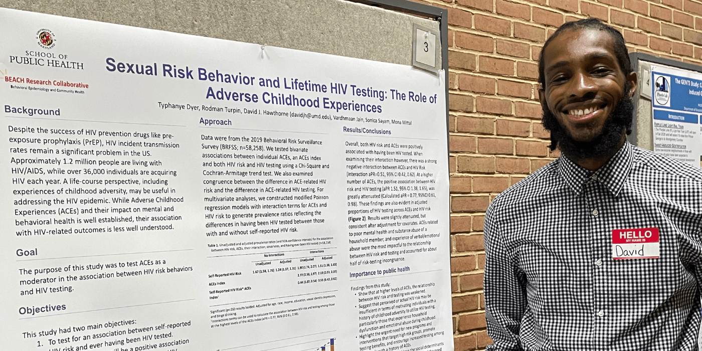 David Hawthorne poses with his poster during the 2022 UMD SPH Poster Session