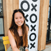 Katelyn Wang, a young woman wearing a black tank top and sunglasses on the top of her head.