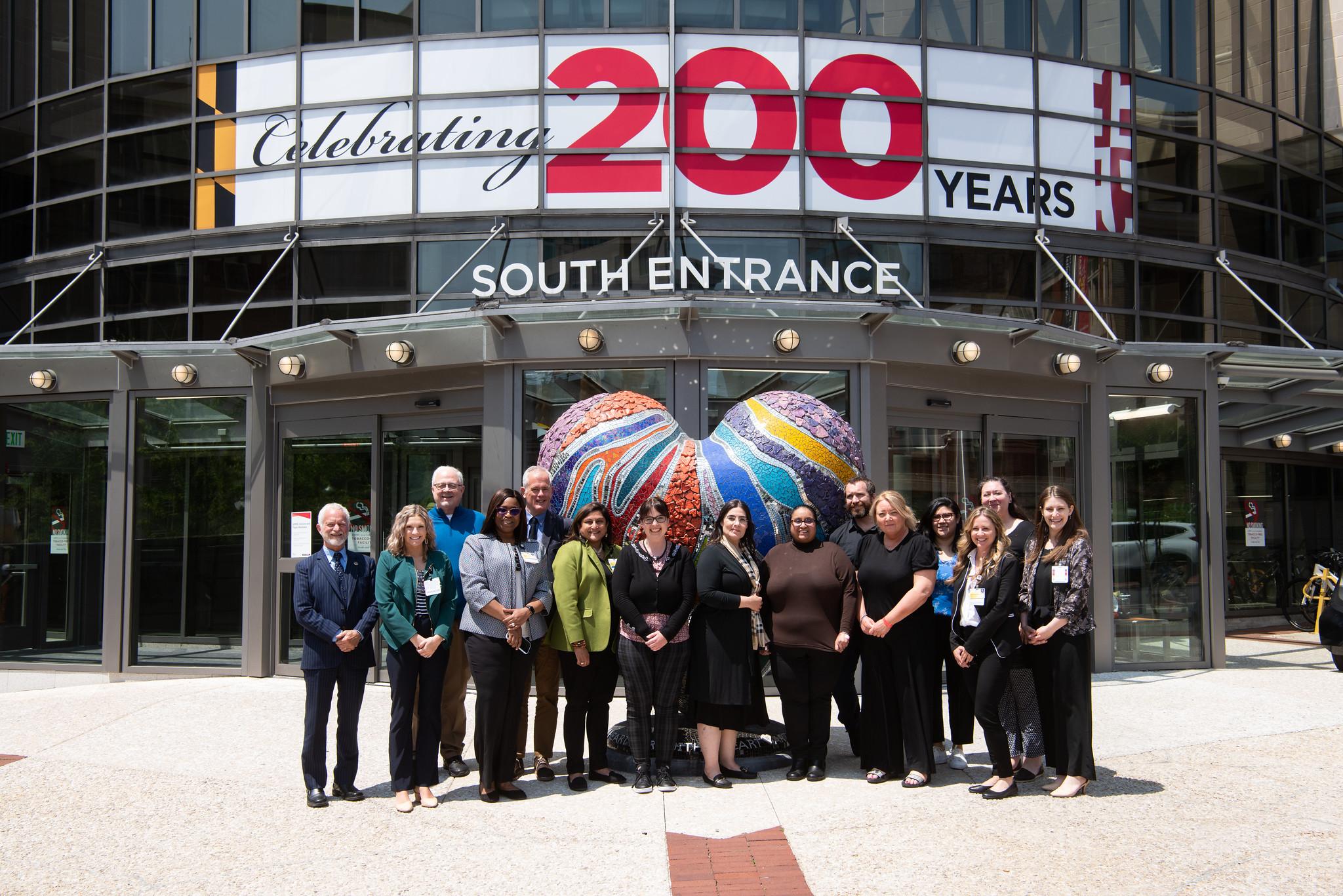 Group of people standing in front of the University of Maryland Medical Center