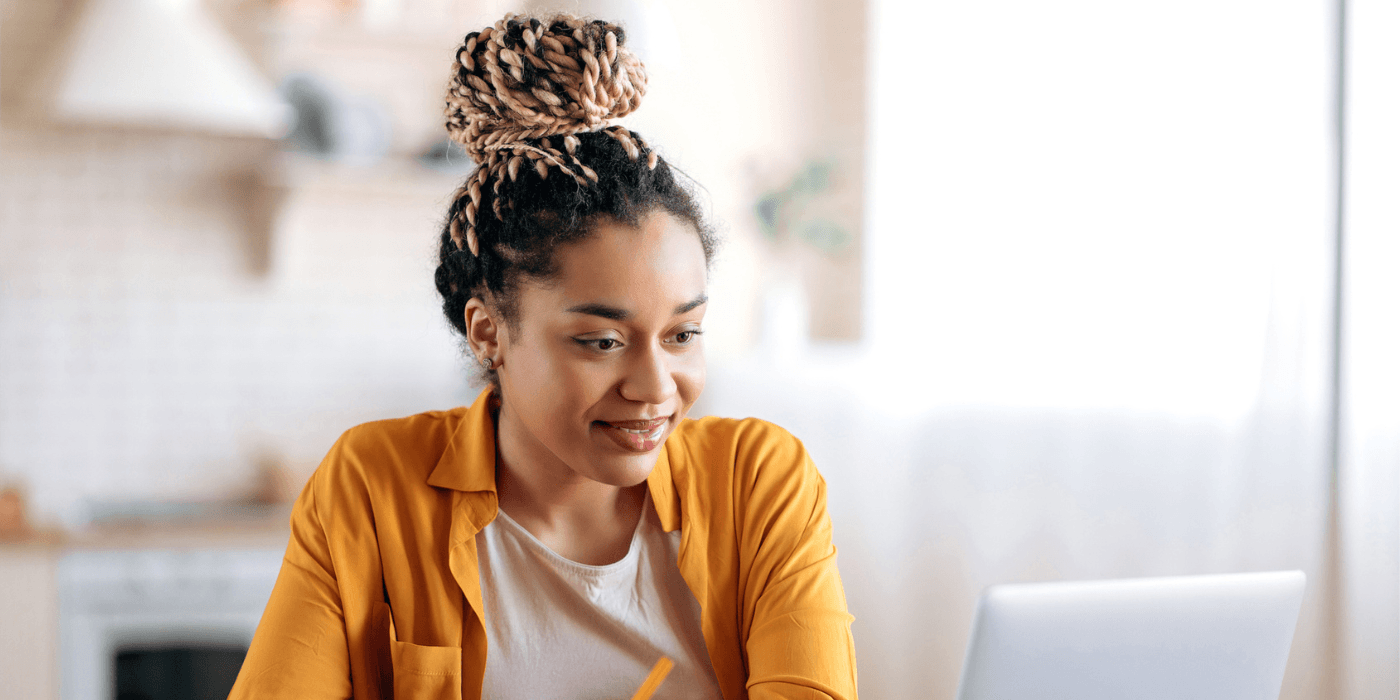 Black woman watching a webinar