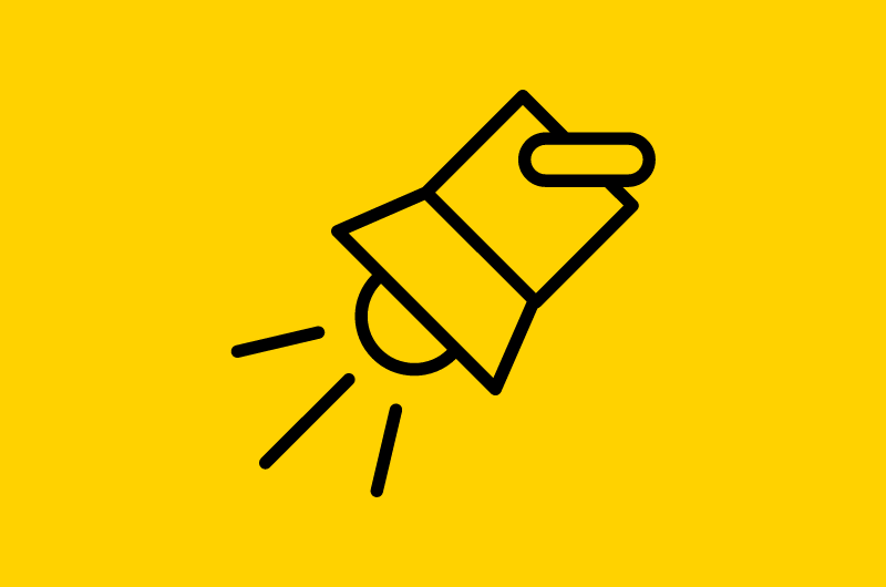 Spotlight icon in black against a yellow background