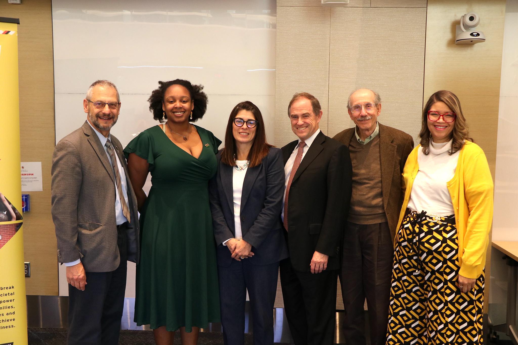 A group pf UMD faculty surround guest speaker  Dr. Laura Herrera Scott, Secretary of Health for the Maryland Health Department. 