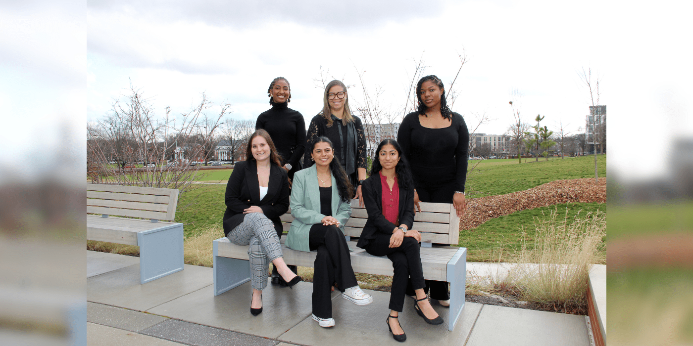 group photo sitting on a park bench