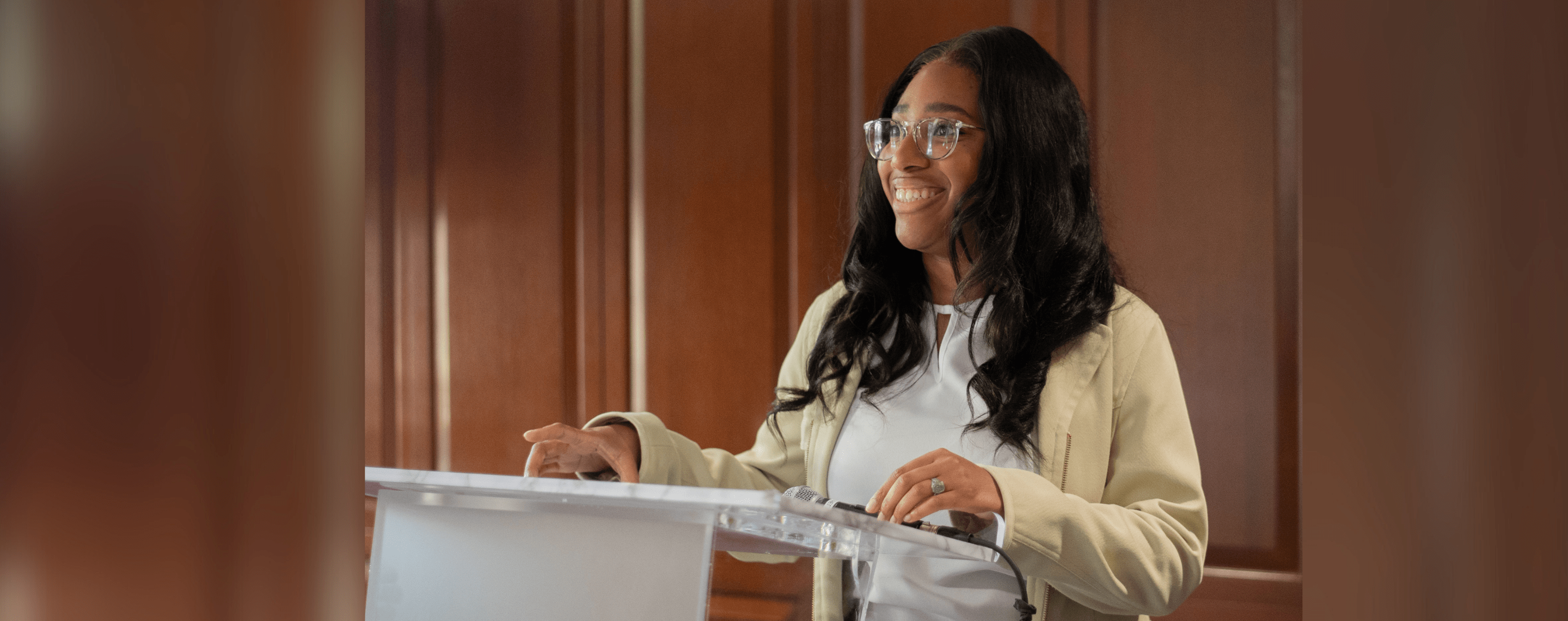 Black female student at podium