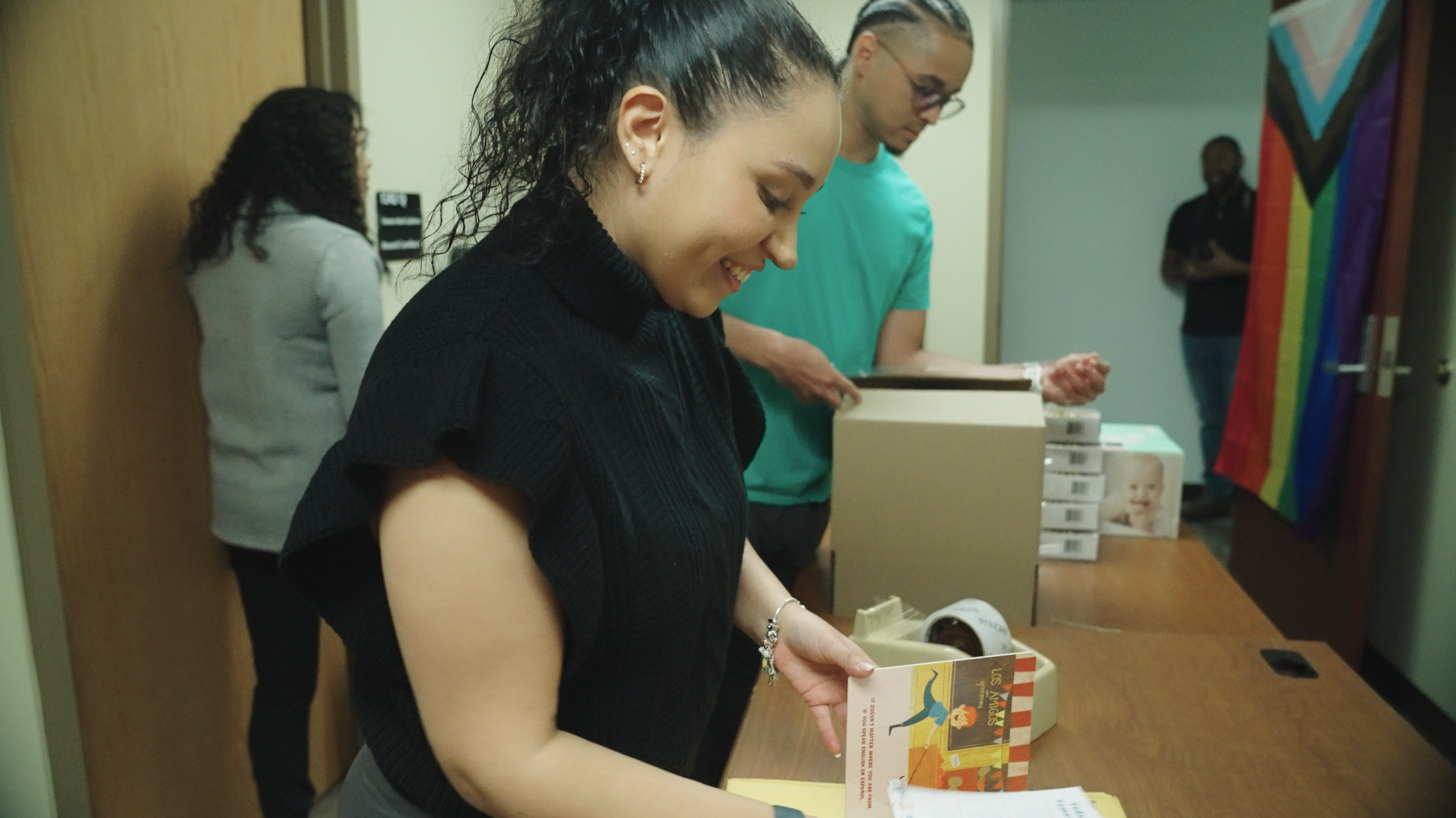 woman putting together a care package for new moms