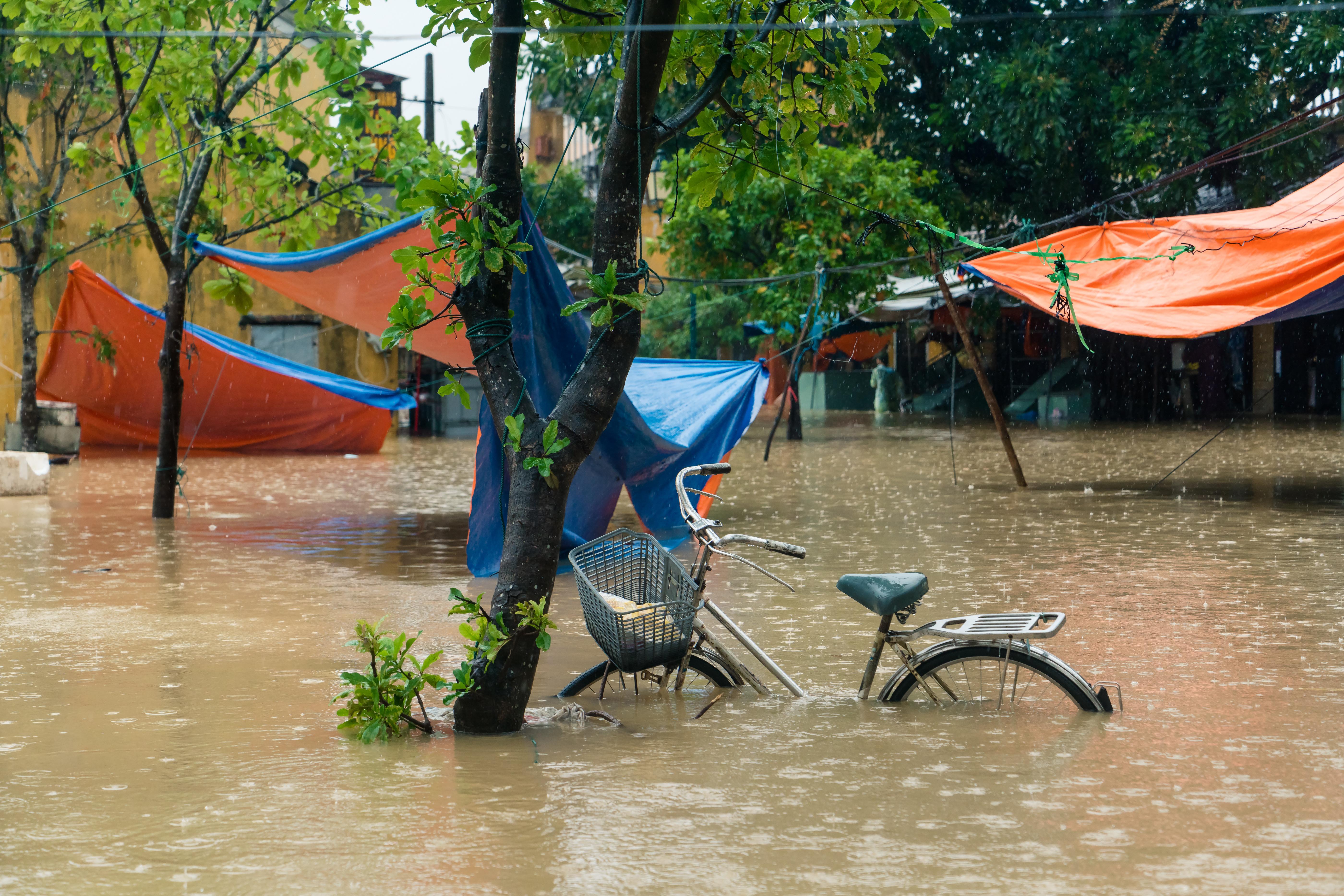 A bike is submerged in floodwater after a typhoon in the Old Town of Hoi An, Vietnam