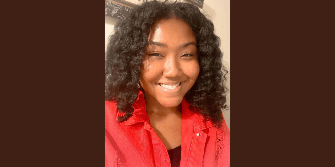 Black female student wearing a red shirt