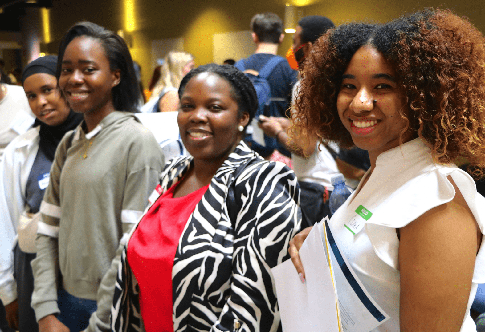 Three graduate students at Fall 2023 orientation