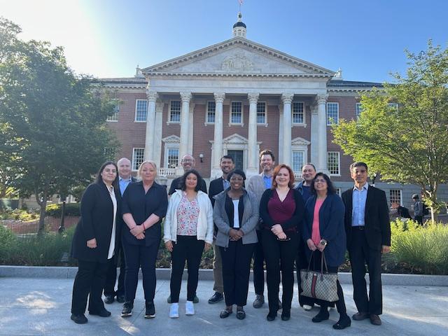 U21 group pose in front of Maryland building