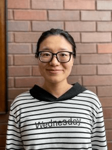 Heidi Huang, PhD, CARES Lab Grad Student, Person with dark hair and glasses smiling