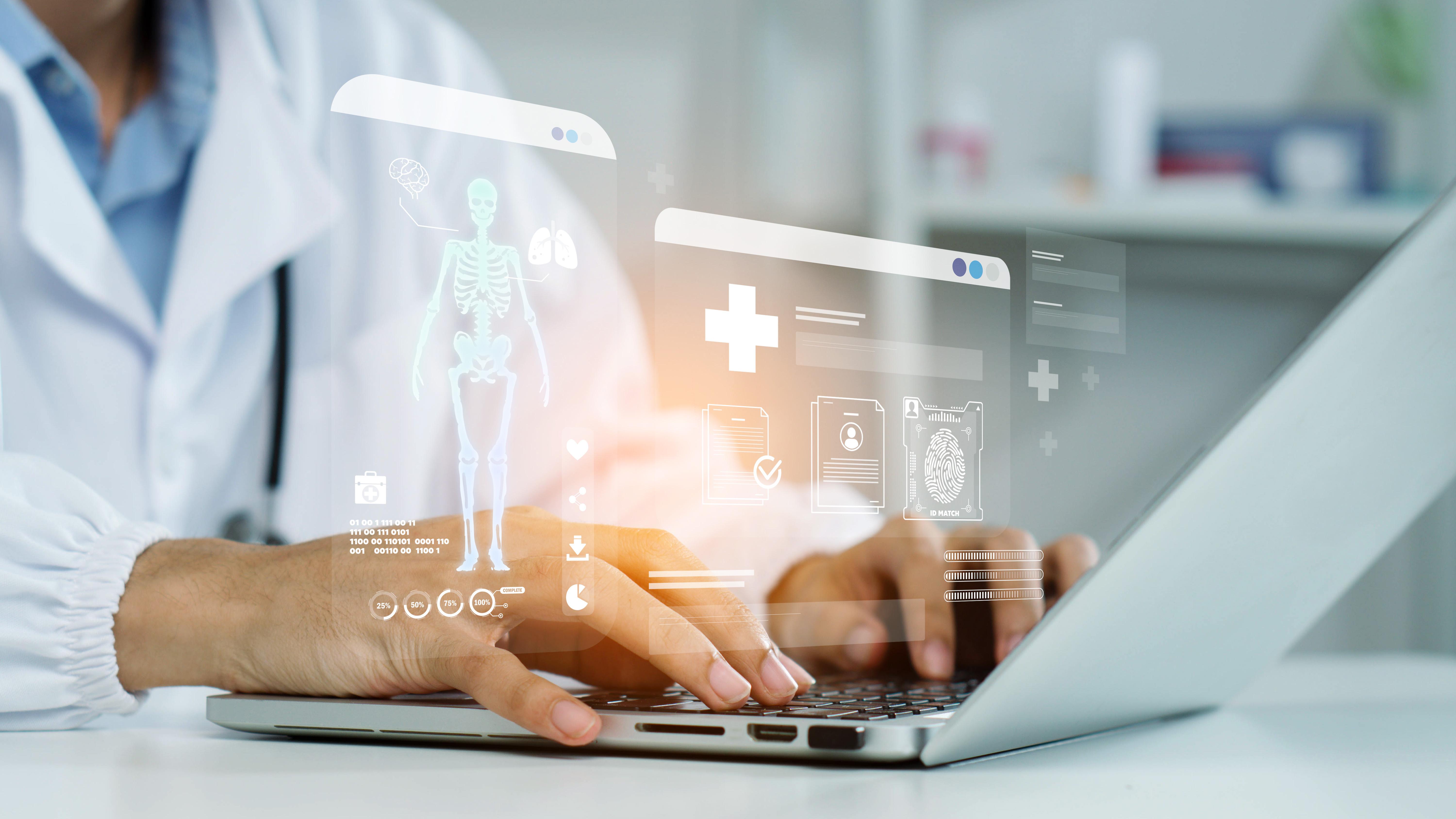 doctor's hands typing on a computer with images of data overlaid
