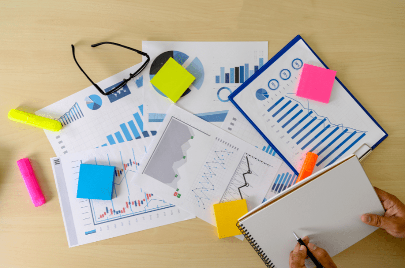 stock image of research papers on a table