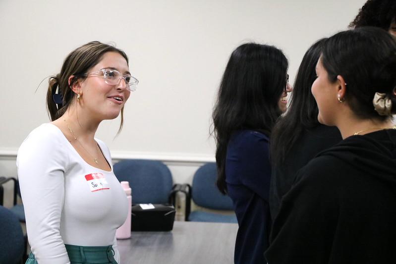Two people talking in a professional setting