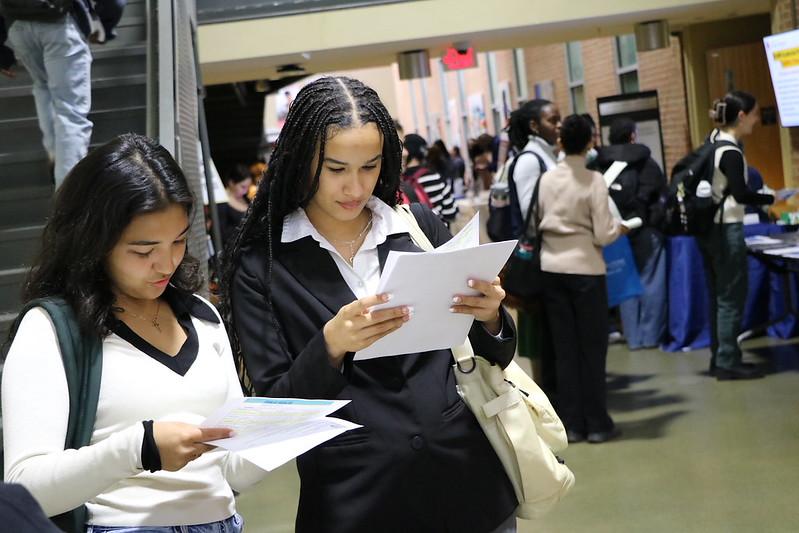 Two people looking at papers