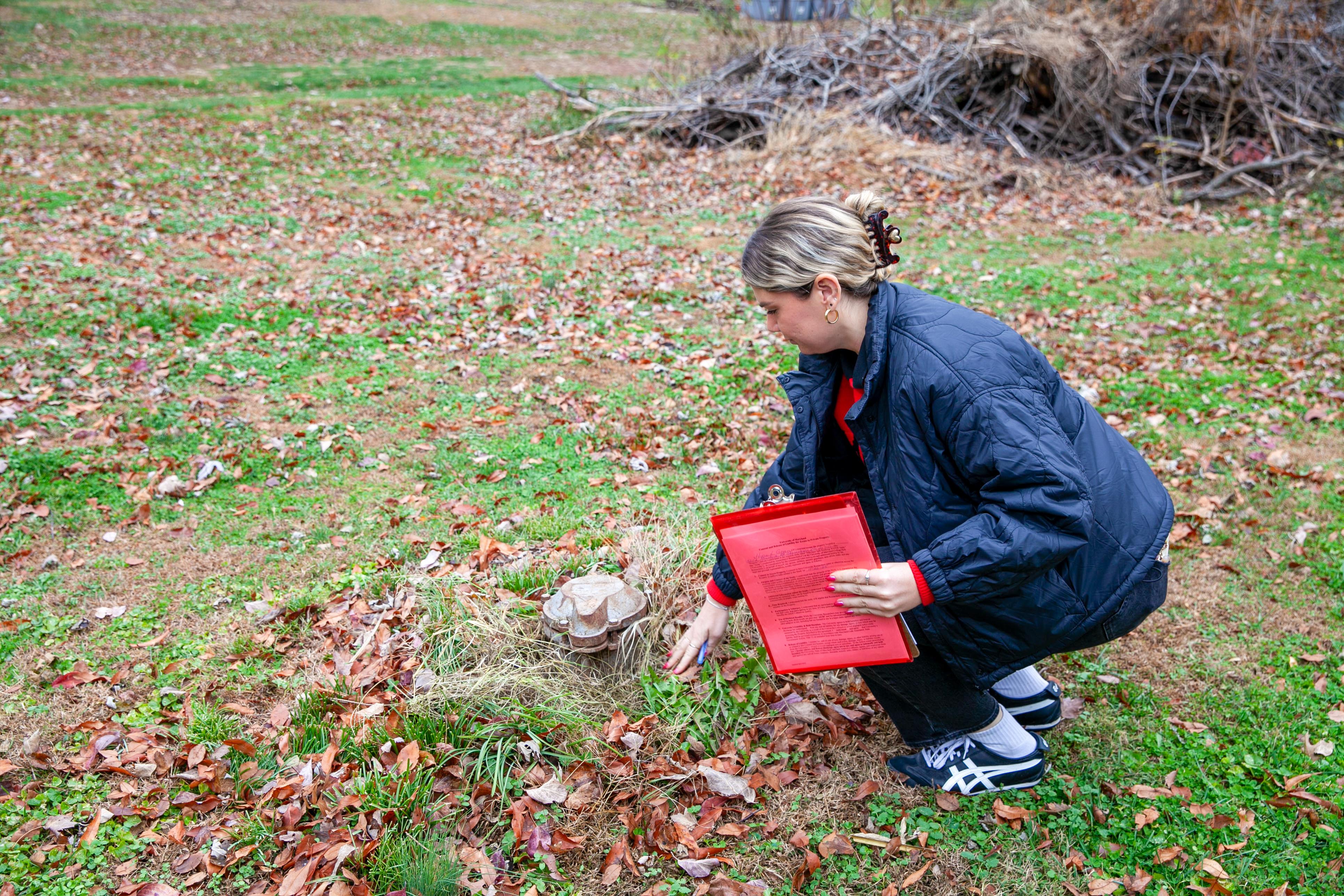 Research manager Georgia Parolski finds the well water at a participant's house.