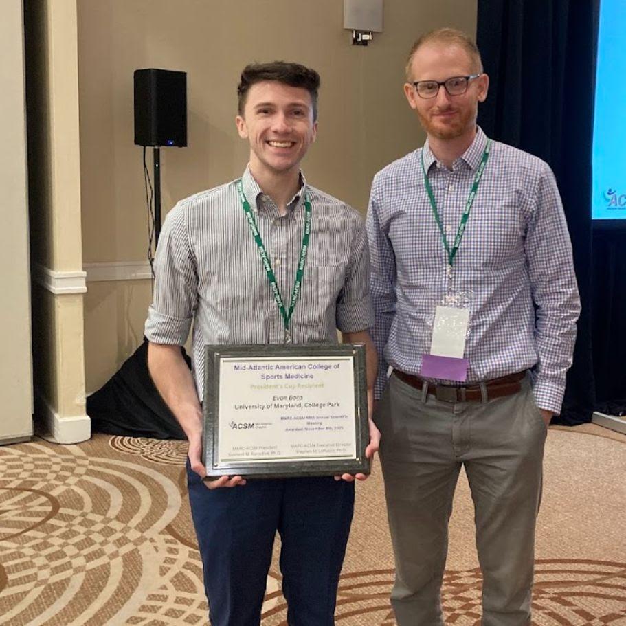 Photograph of Evan Bota receiving the MARC-ACSM President's Cup award
