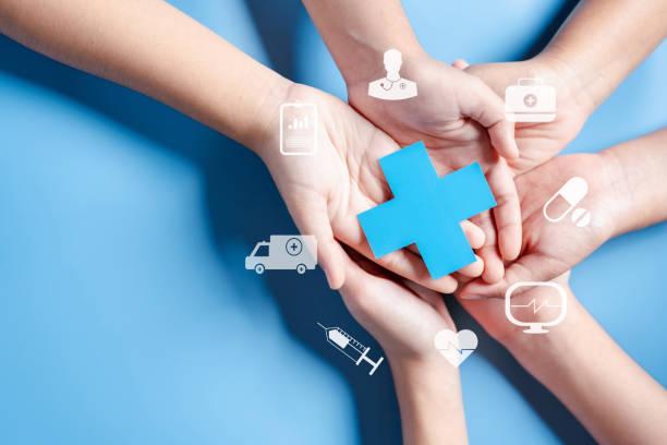 Health insurance concept. Doctor in a white coat uniform hand holding plus and healthcare medical icon, health and access to welfare health concept.