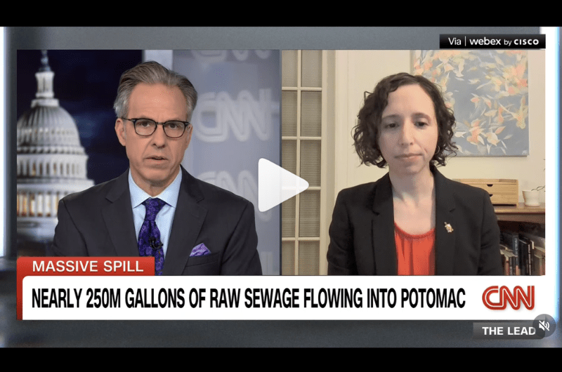 Male journalist interviewing female researcher on tv