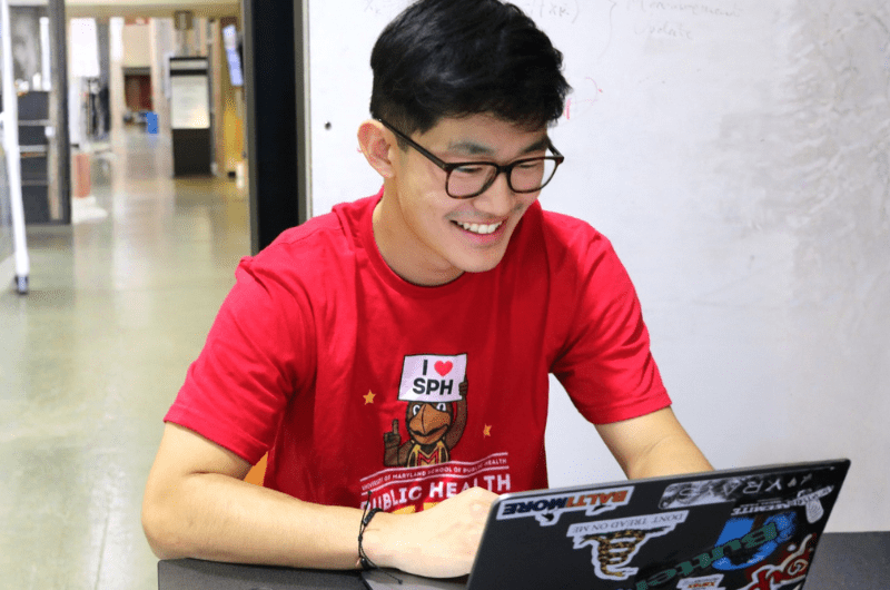 A male student on his laptop