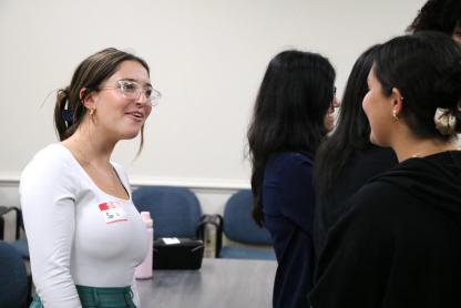 Two people talking in a professional setting