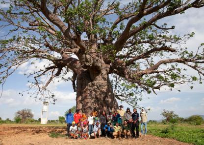 UMD graduate students under a tree in Africa